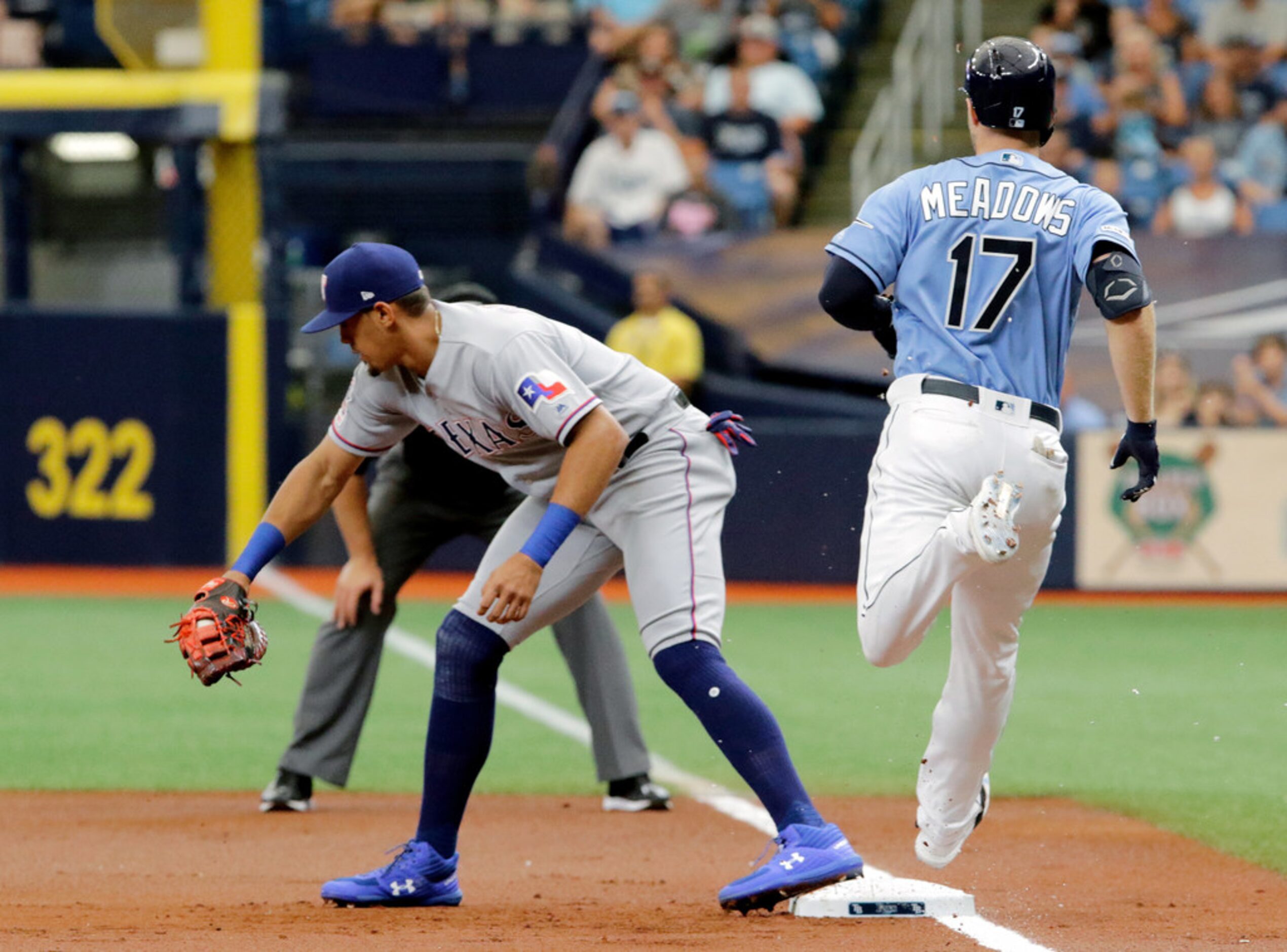 ST. PETERSBURG, FL - JUNE 30:  Ronald Guzman #11 of the Texas Rangers catches the ball at...