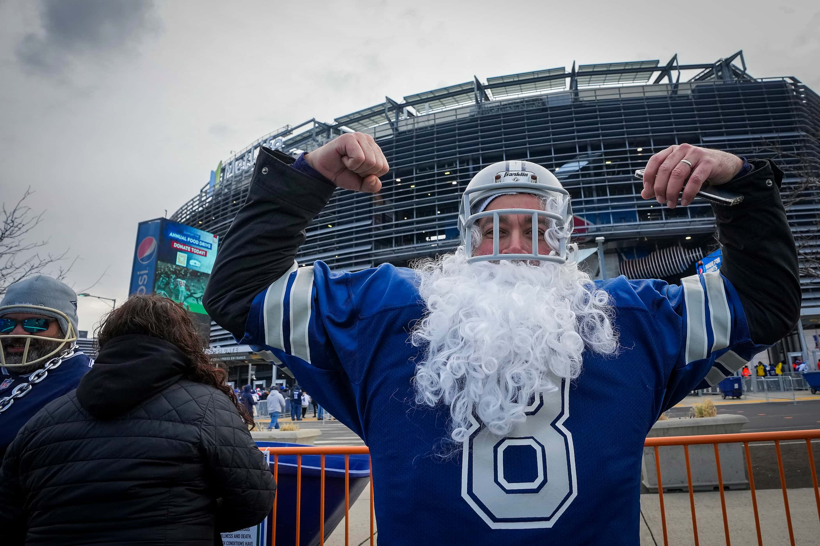 Dallas Cowboys fan Dan Centeno flexes while tailgating before an NFL football game against...