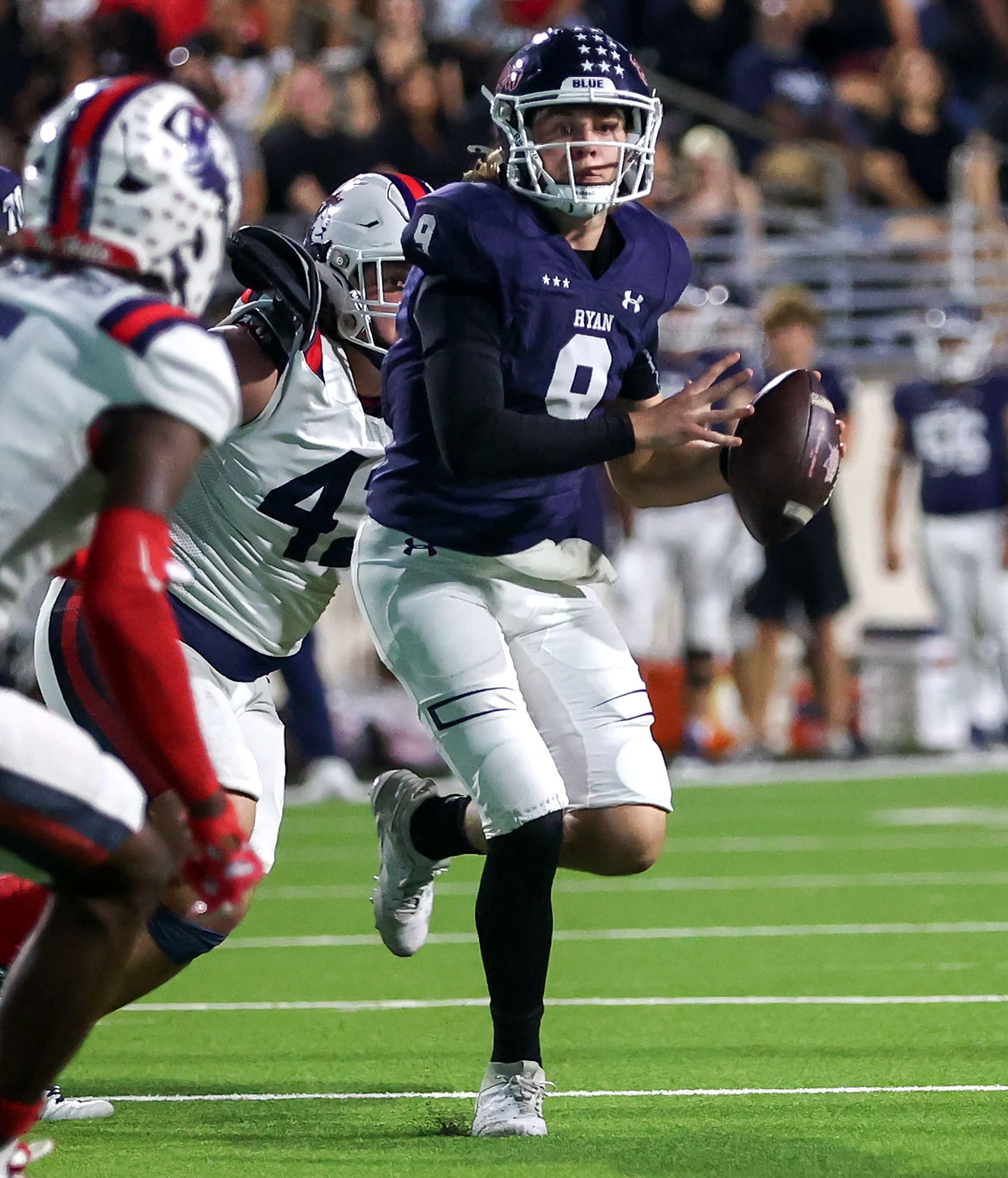 Denton Ryan quarterback Quin Henigan (9) looks for a receiver against Richland during the...