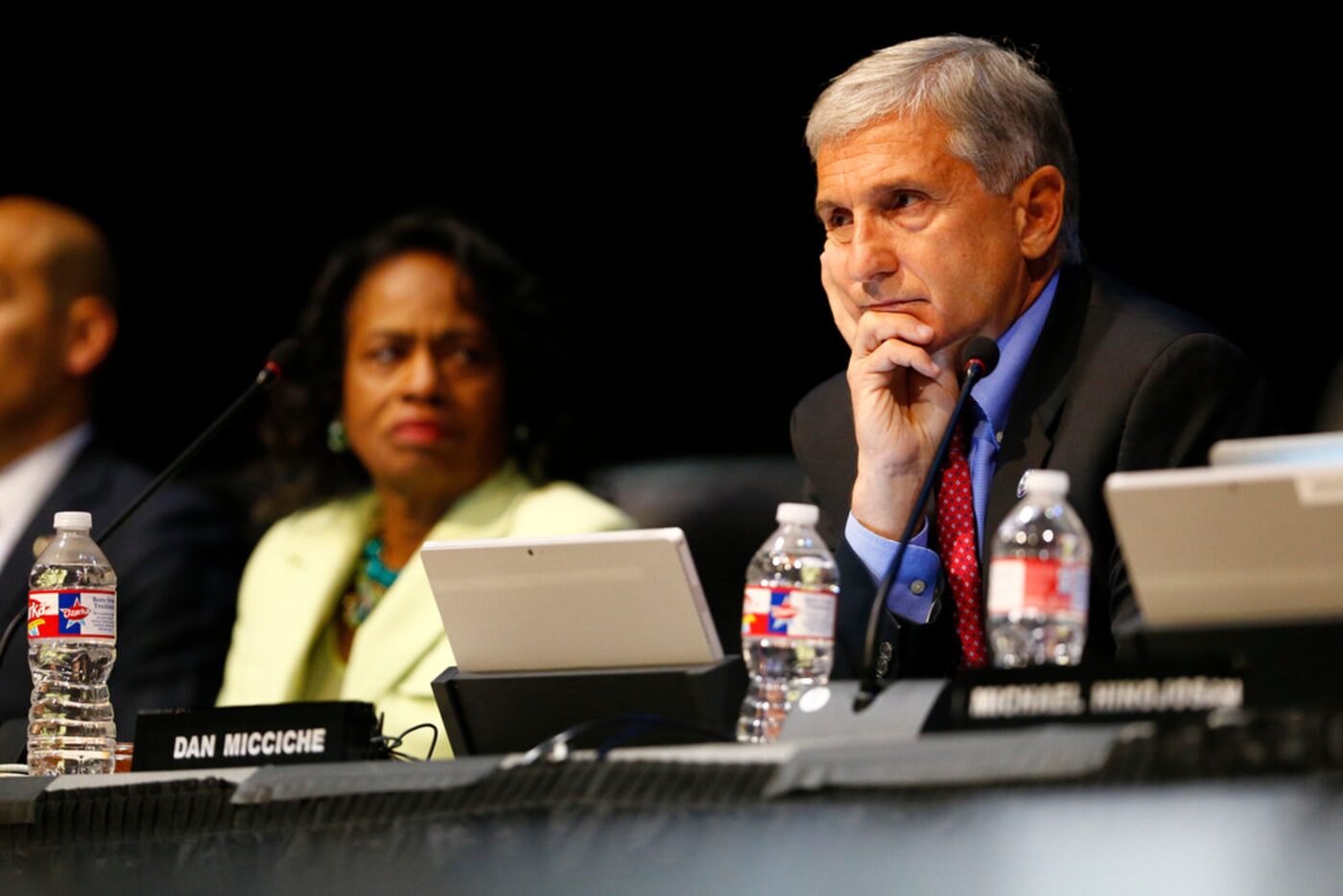 Dan Micciche, board member, listens during the public forum about the debate about changing...