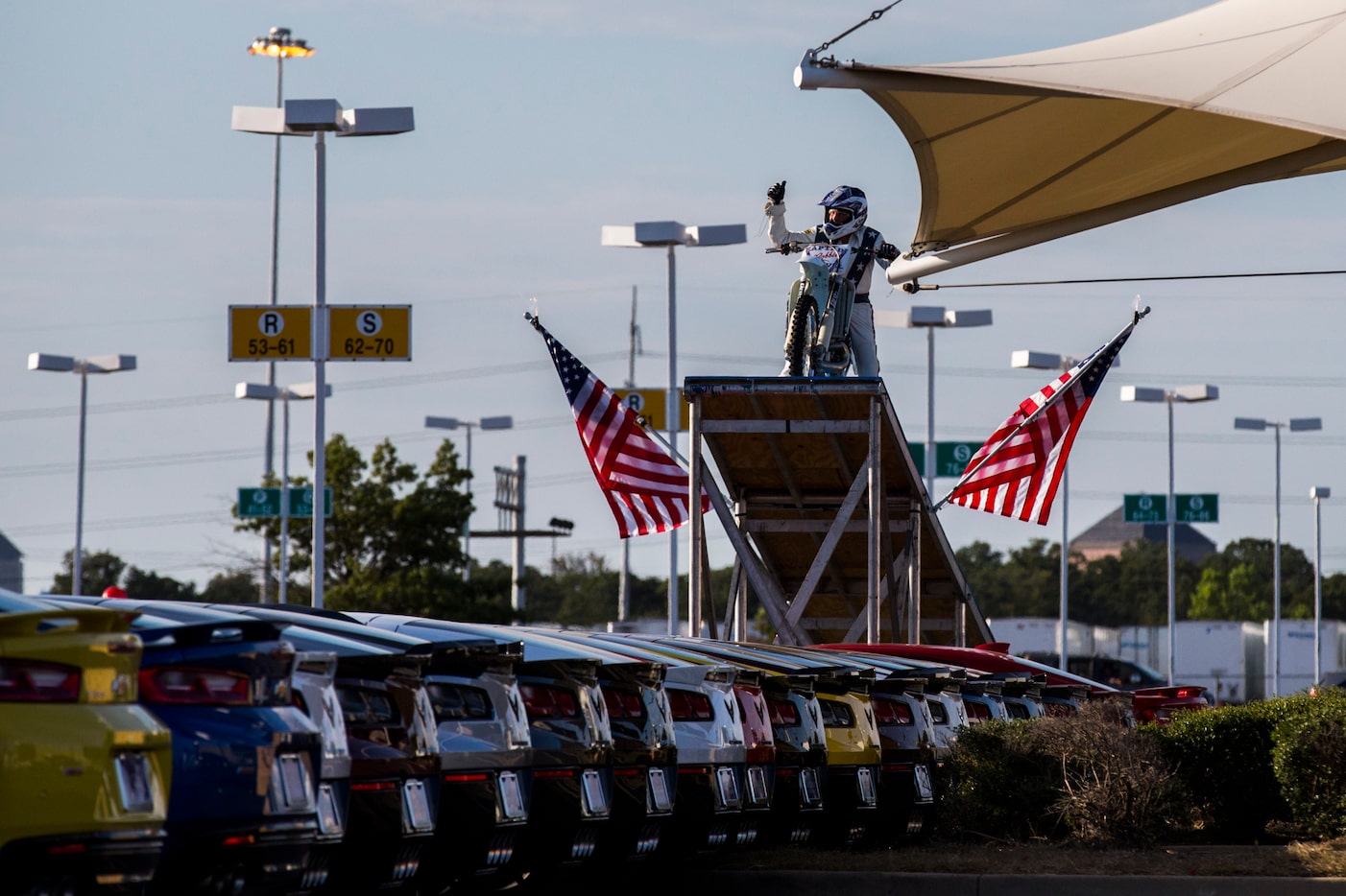 Daredevil Robbie Knievel prepares to jump over 18 Corvettes during a celebration and...