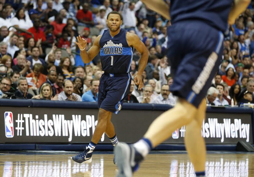 Dallas Mavericks guard Justin Anderson (1) celebrates after making a three pointer in a game...