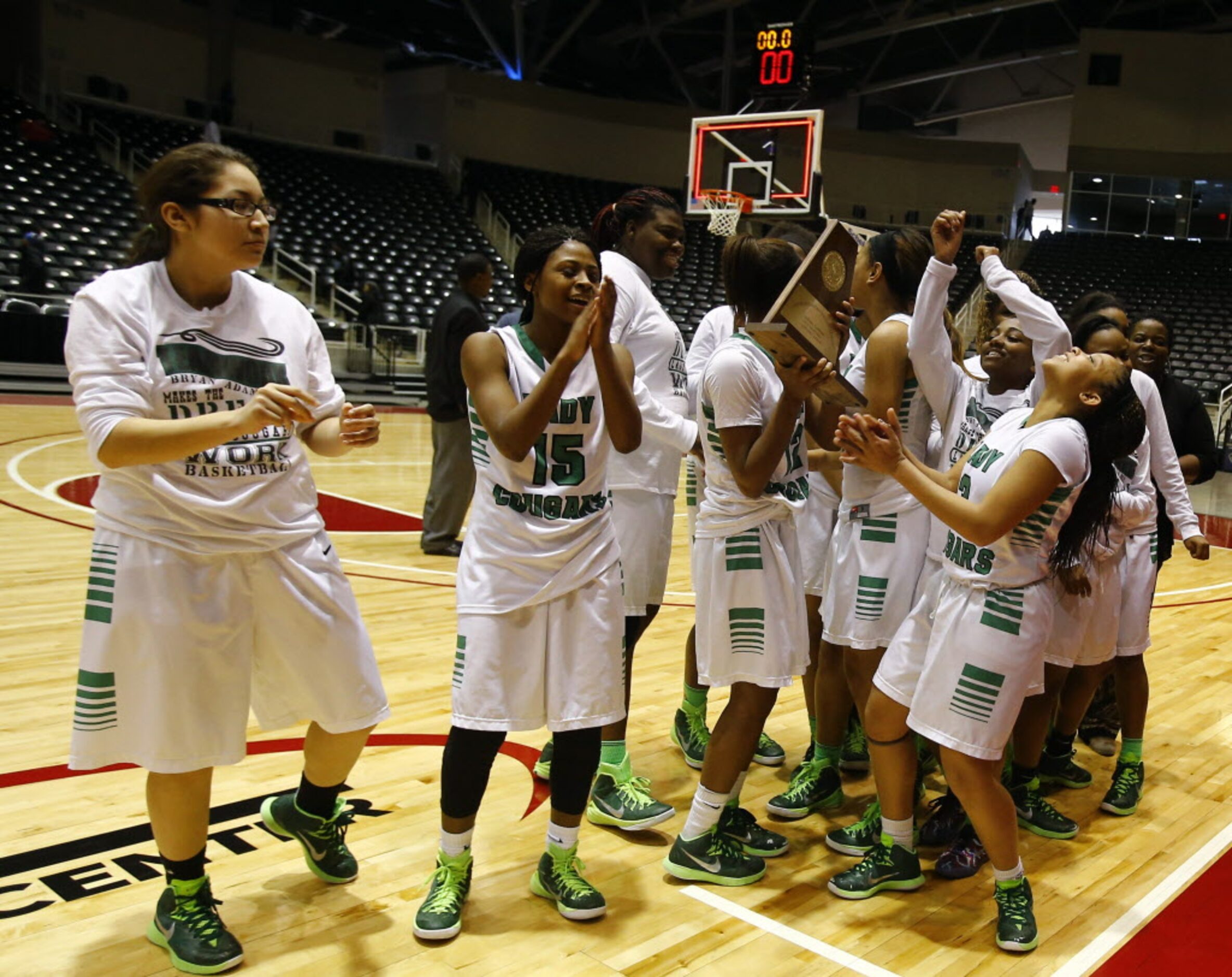 Bryan Adams celebrates after winning the Class 5A Region II girls basketball championship...