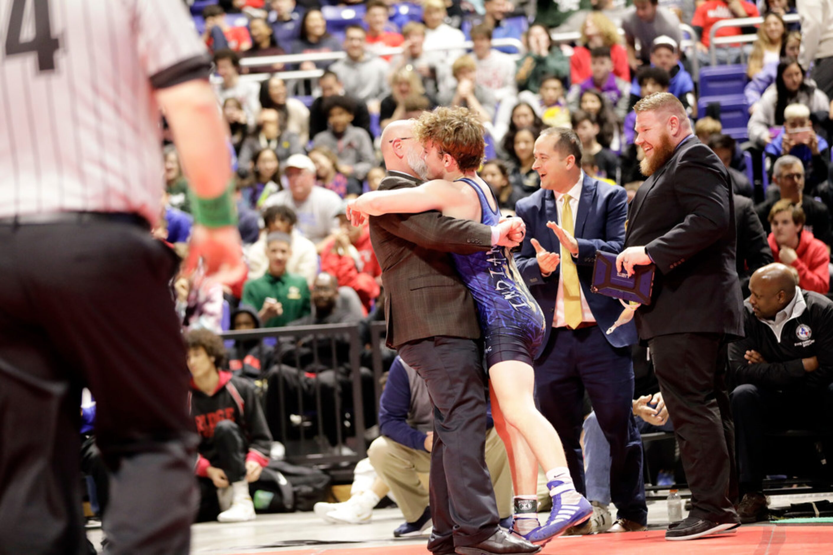 Parker Decker of Keller wrestles against Tagen Jamison of Plano West during the UIL Texas...