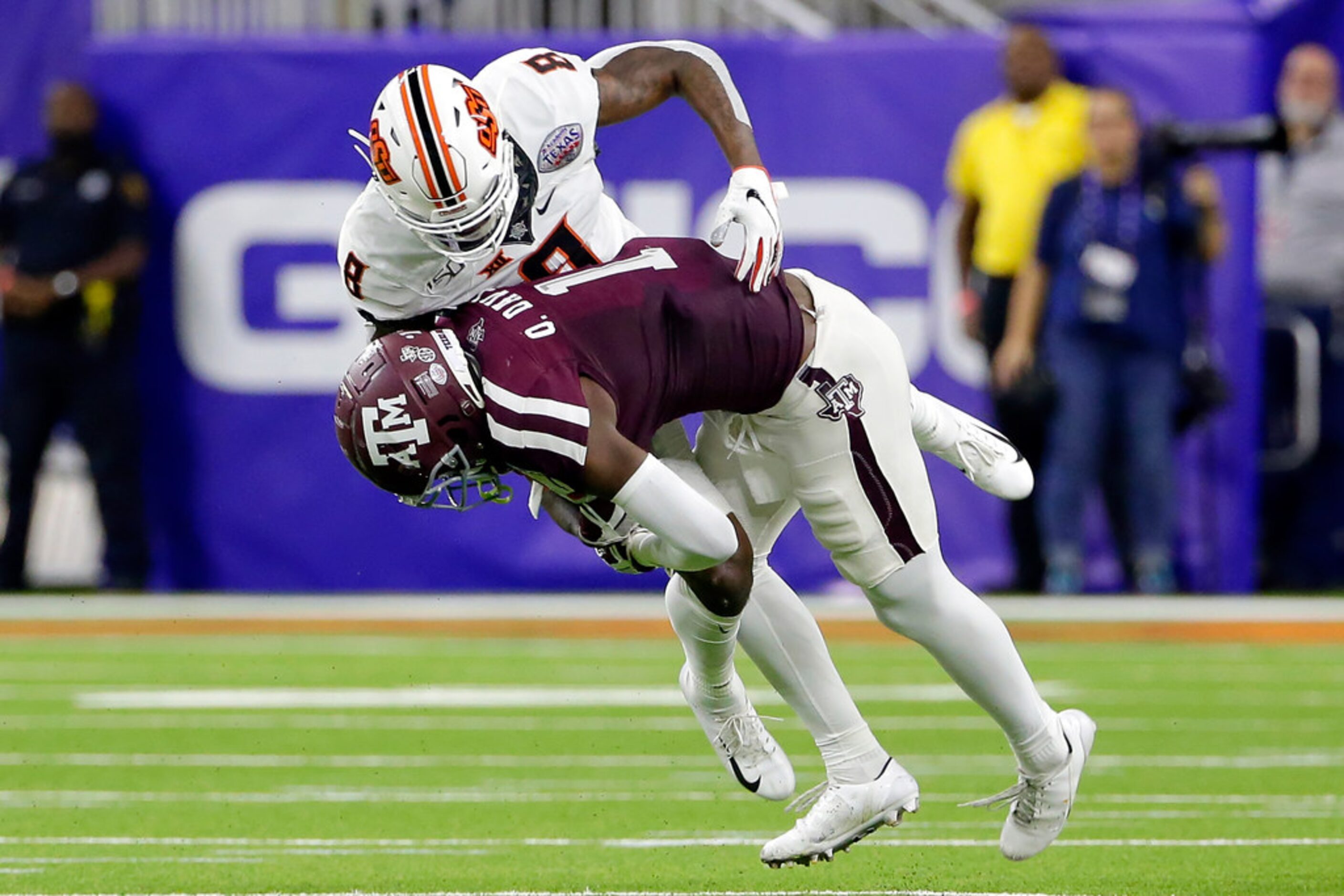 Texas A&M wide receiver Quartney Davis (1) is tackled by Oklahoma State cornerback Rodarius...