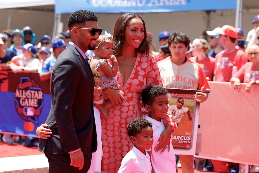 Texas Rangers second baseman Marcus Semien poses for pictures with his wife Tarah Murrey and...