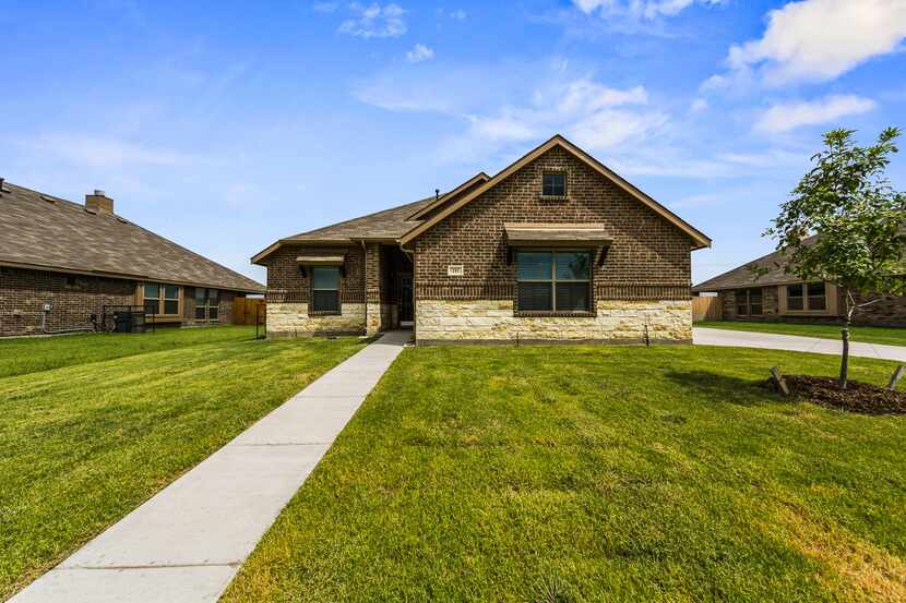 The Robbie Hale custom residence at 717 Long Prairie in Royse City is priced at $251,900. It...