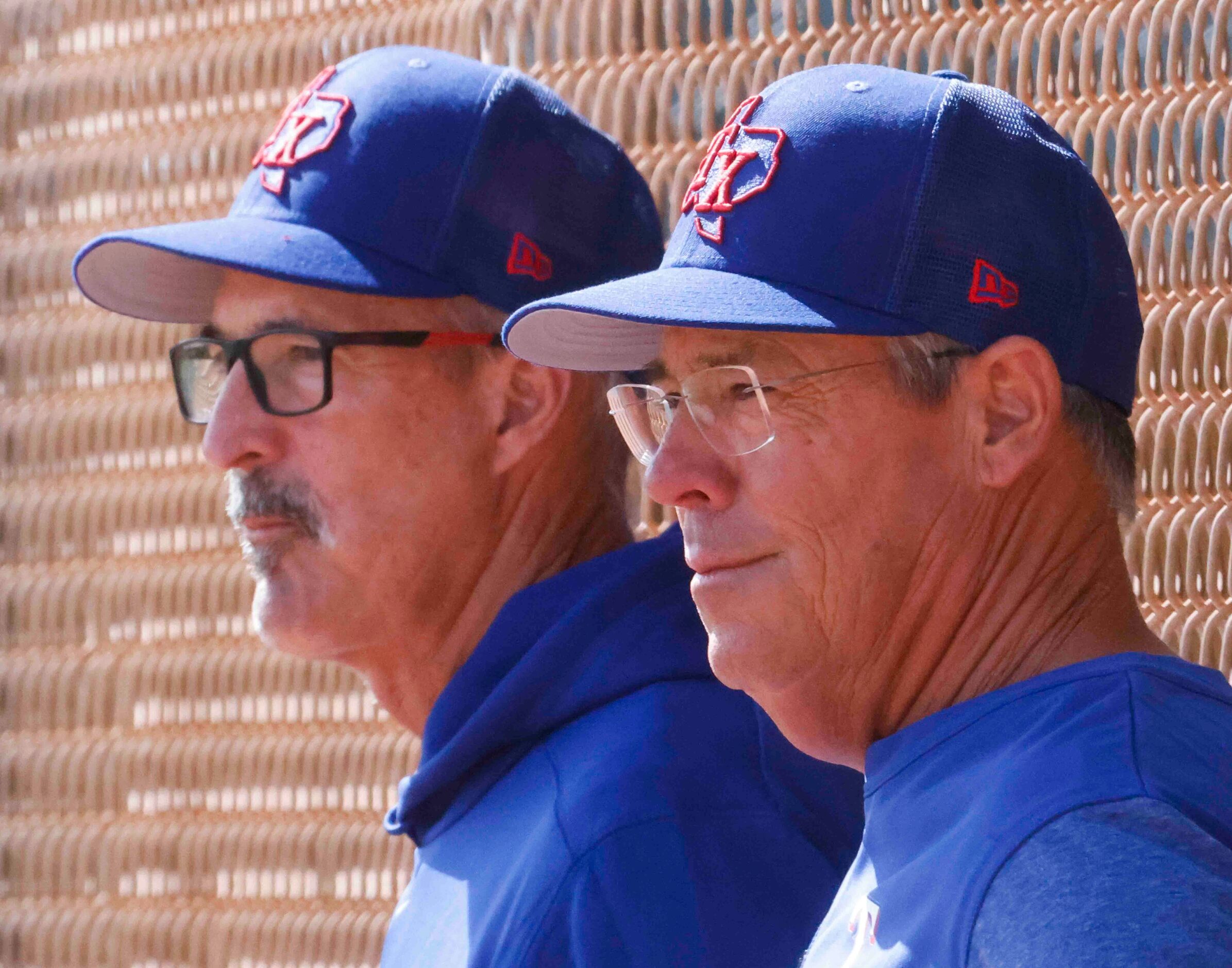 Texas Rangers pitching coach Mike Maddux, left, and special assistant Greg Maddux watch...