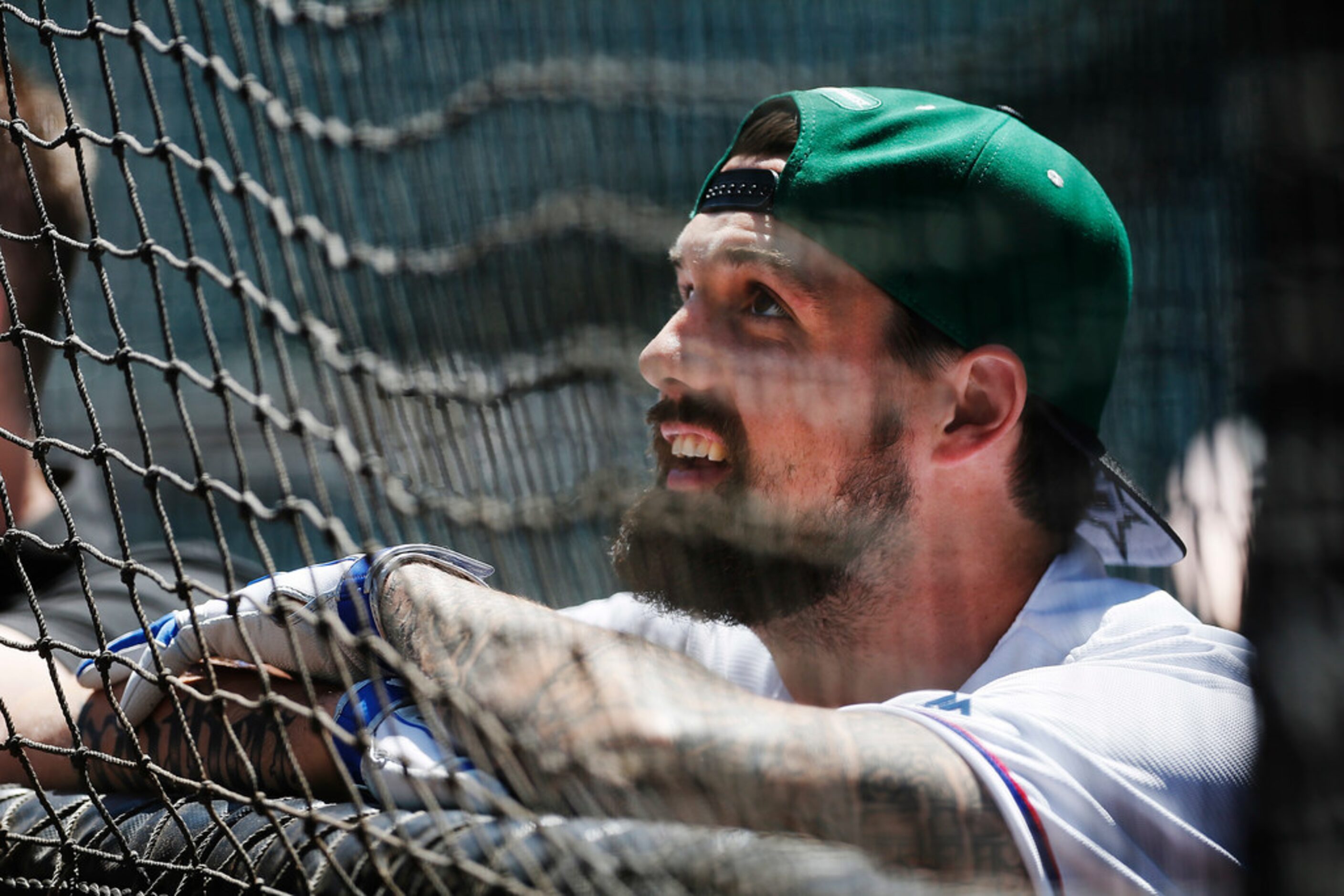 Dallas Stars captain Jamie Benn looks on as his teammate, goalie Ben Bishop, participates in...