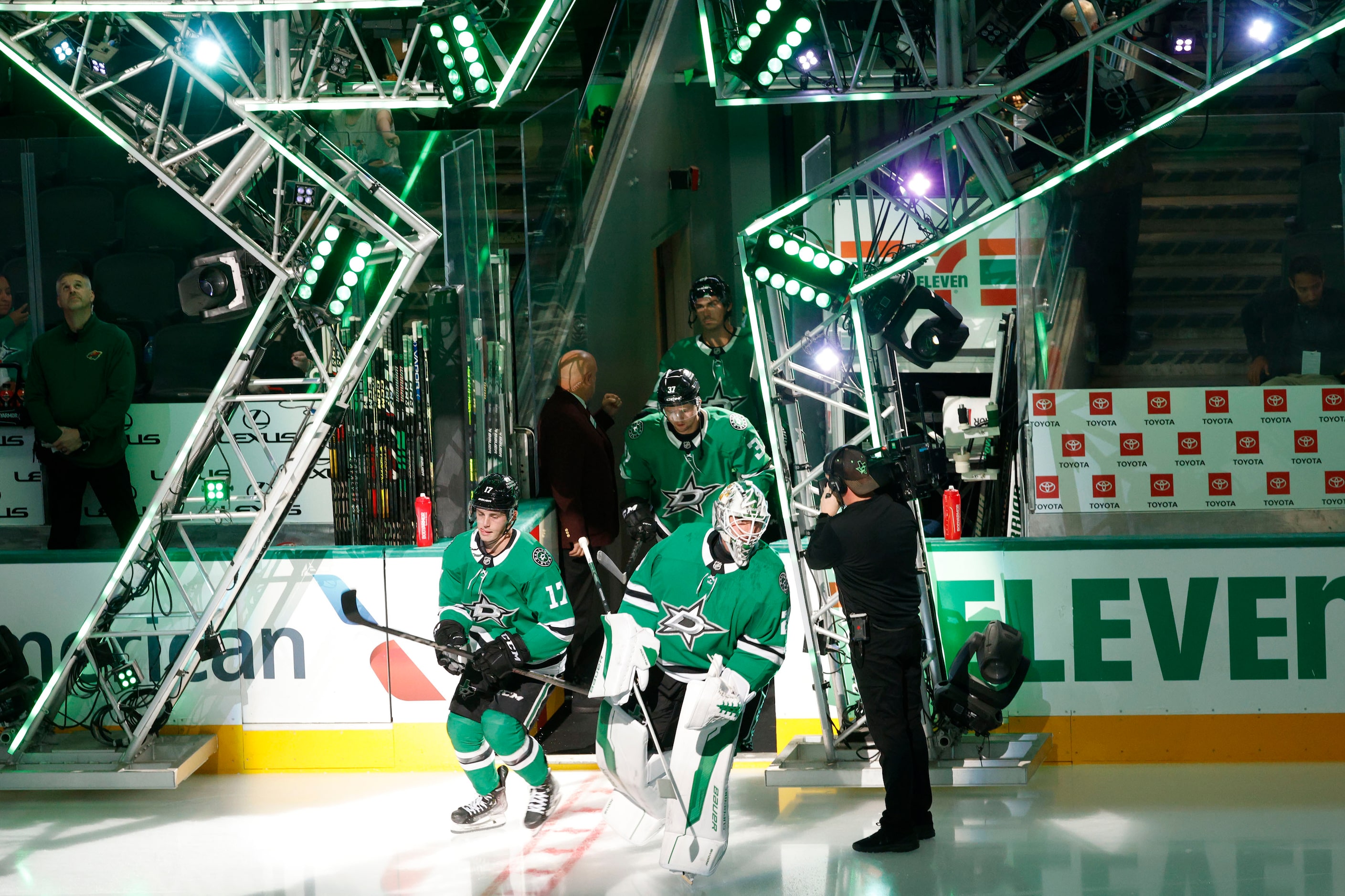 Dallas Stars players including Dallas Stars goaltender Jake Oettinger (29)  come out before...