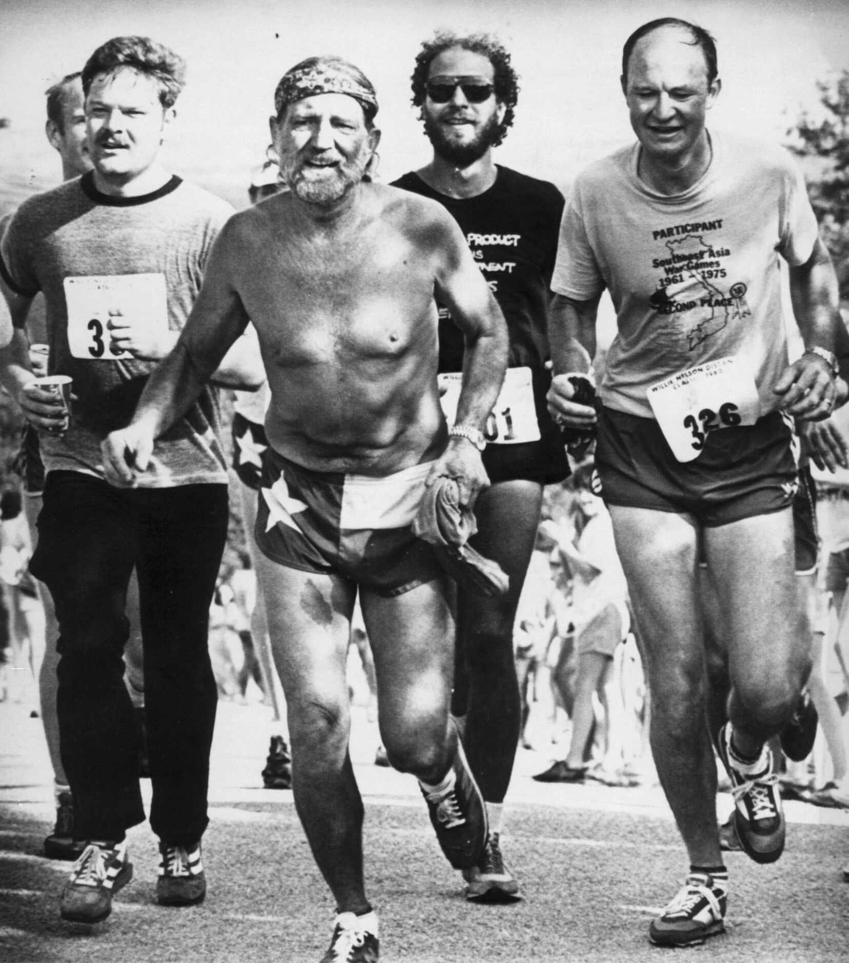 1980 - Willie Nelson crosses the finish line at the first annual Willie Nelson Distance...