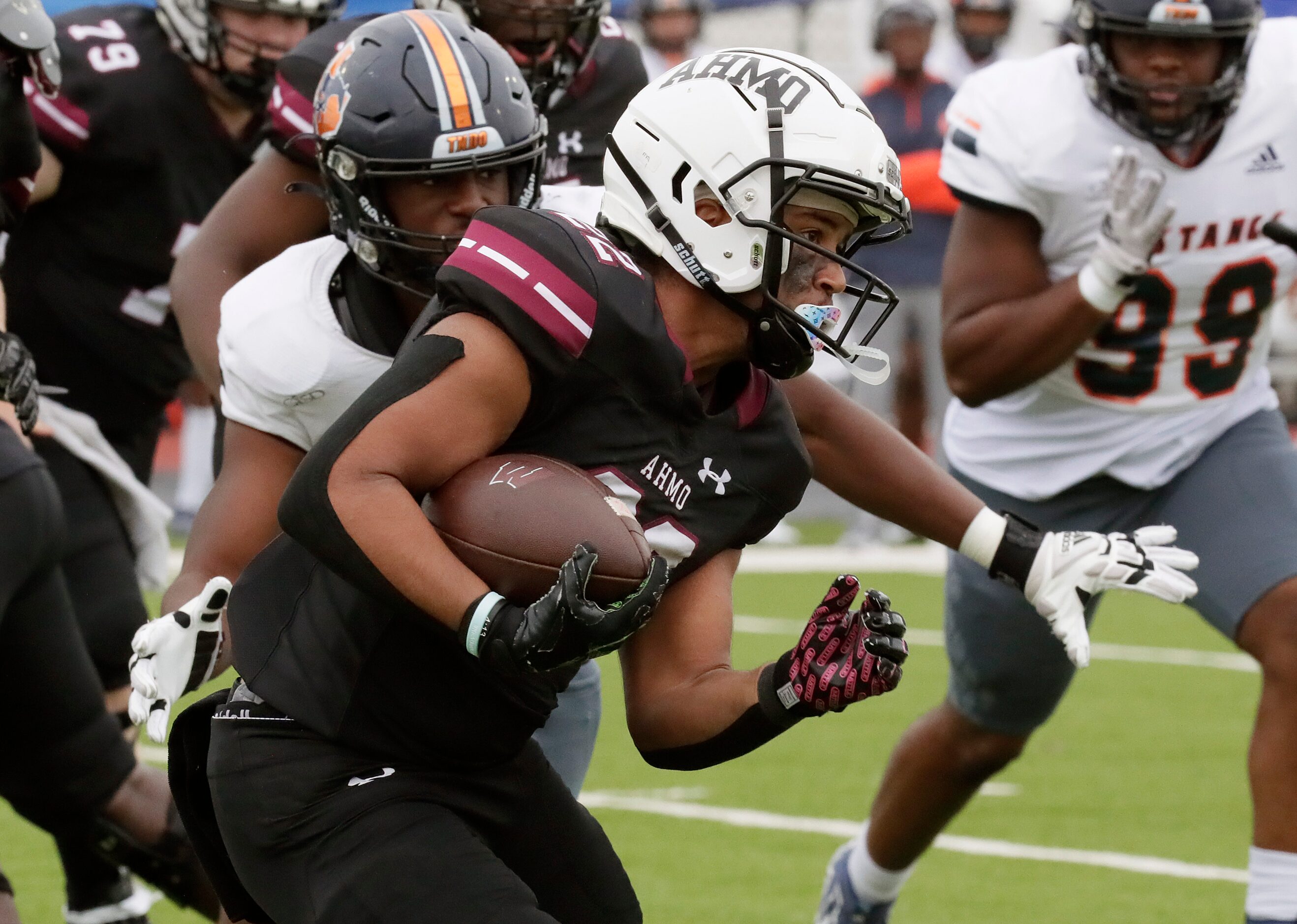 Wylie High School running back Joshua Ausborne (22) gets yardage during the first half as...