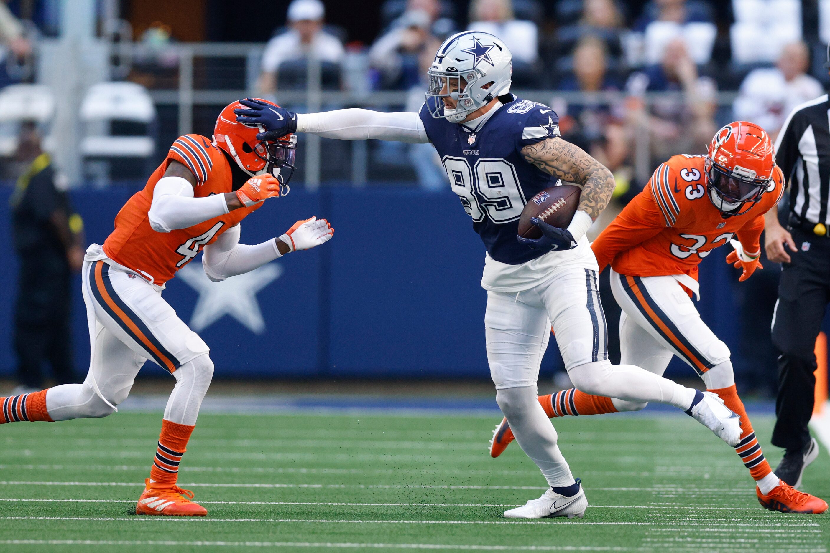 Dallas Cowboys tight end Peyton Hendershot (89) stiff-arms Chicago Bears safety Eddie...