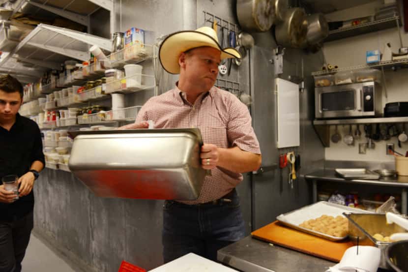 Matt Hamilton, Local Yocal owner, delivers ground beef at  the Square Burger kitchen, both...