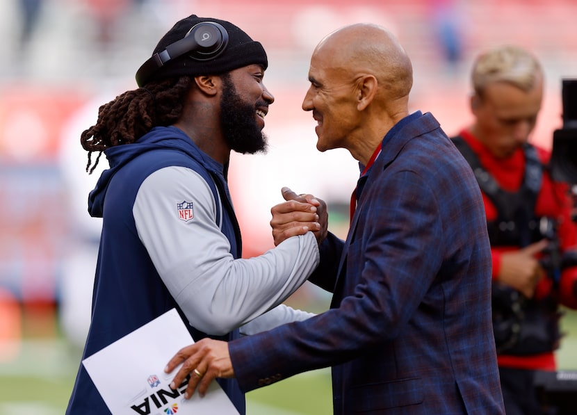 Dallas Cowboys running back Dalvin Cook (left) shakes hands with former NFL coach Tony Dungy...