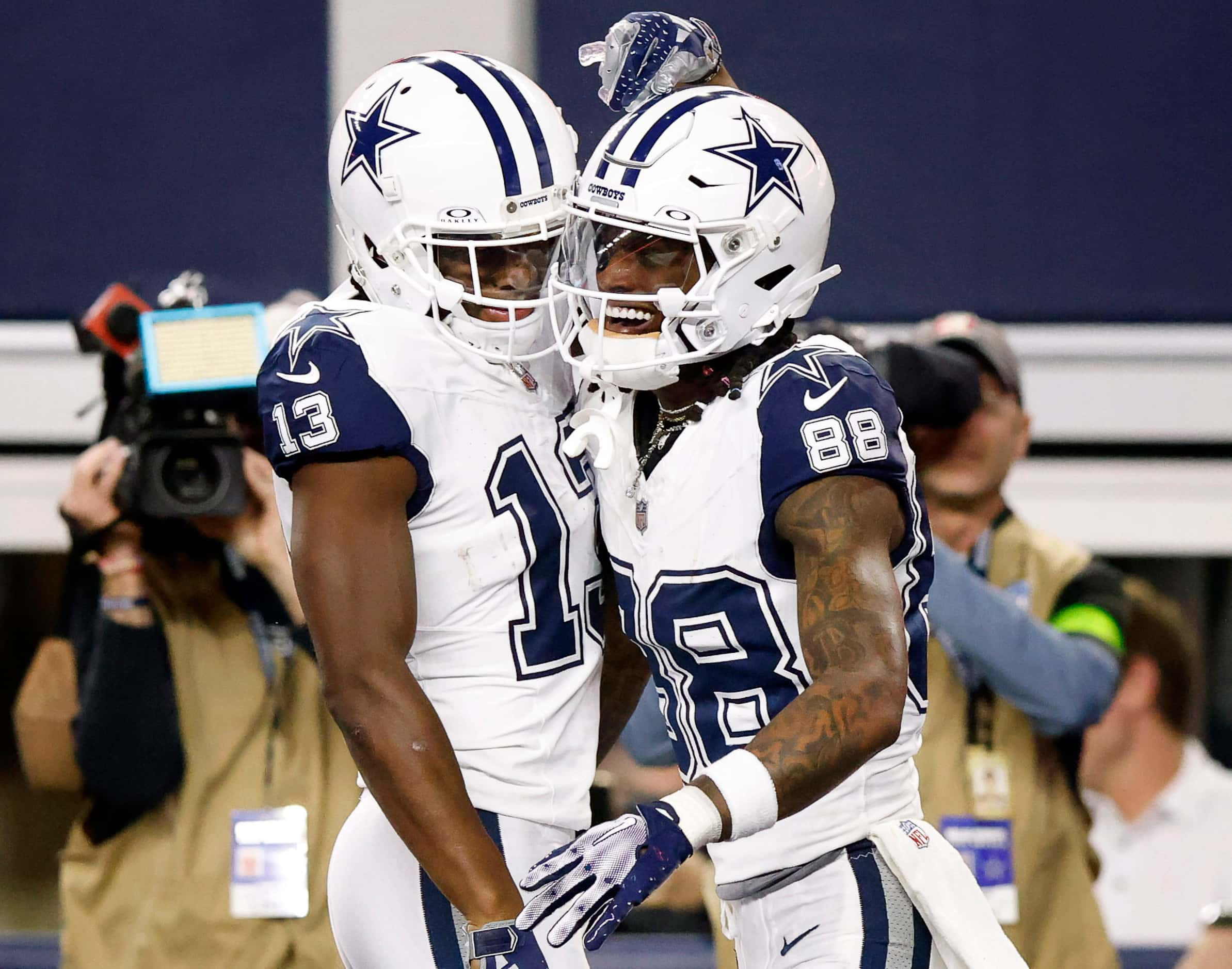 Dallas Cowboys wide receiver Michael Gallup (13) congratulates fellow receiver CeeDee Lamb...