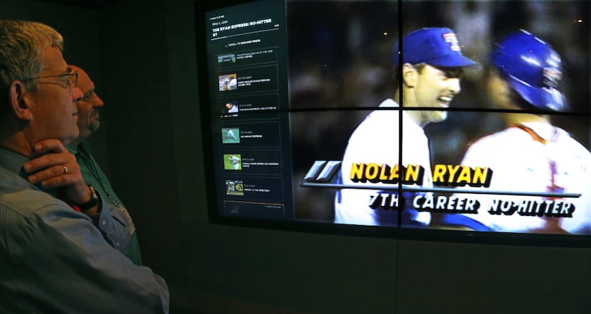 Baseball Hall of Fame Curator John Odell and DMN baseball writer Evan Grant watch a video...