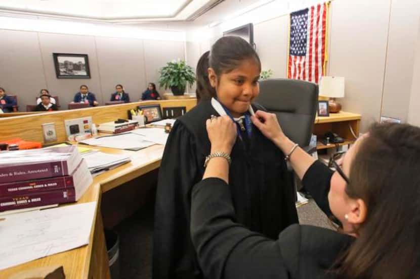 
Assistant District Attorney Rachael Jones helped fourth-grader Valeria Molina with her...