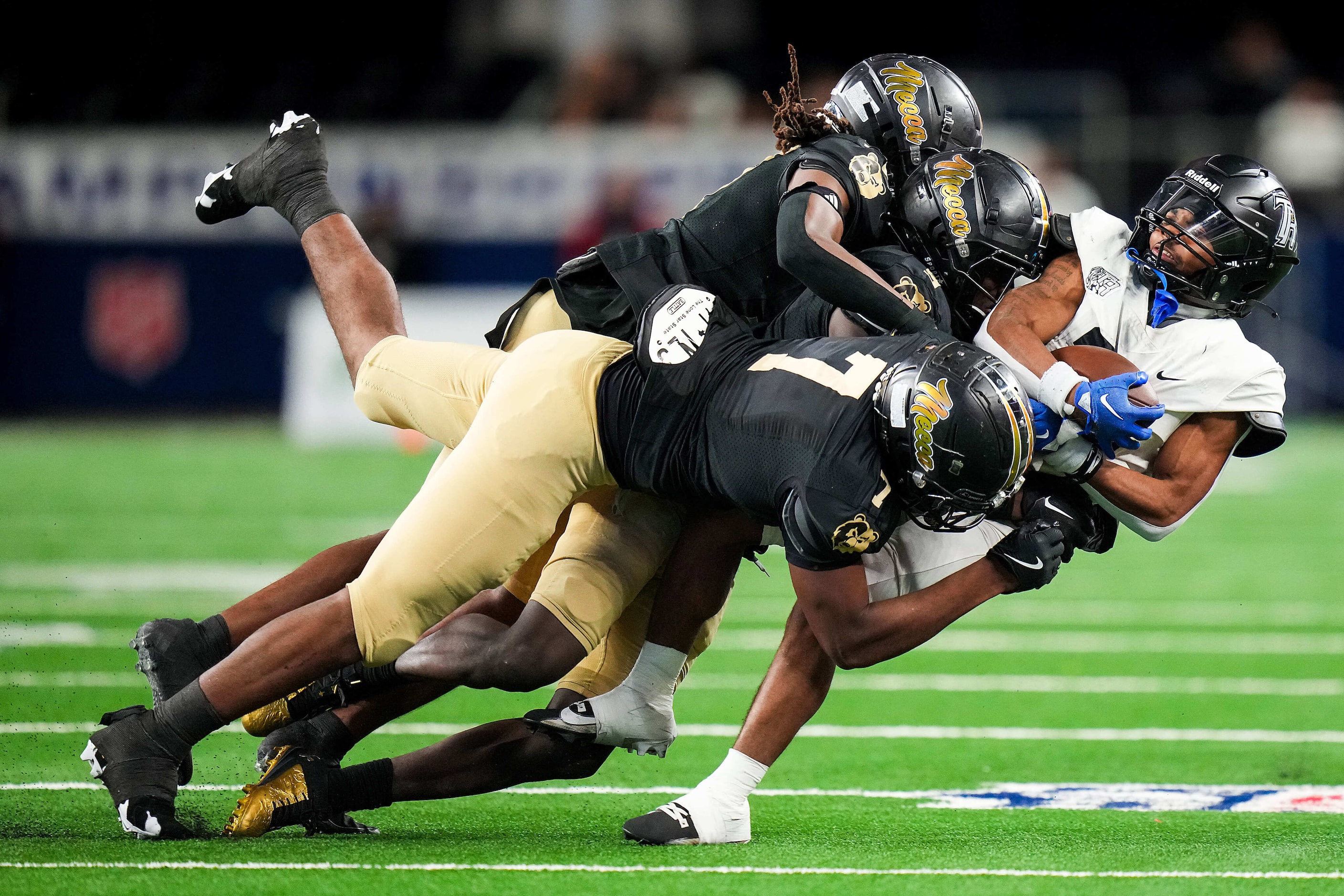 Richmond Randle running back Sincere Timpson (26) is brought down by South Oak Cliff...