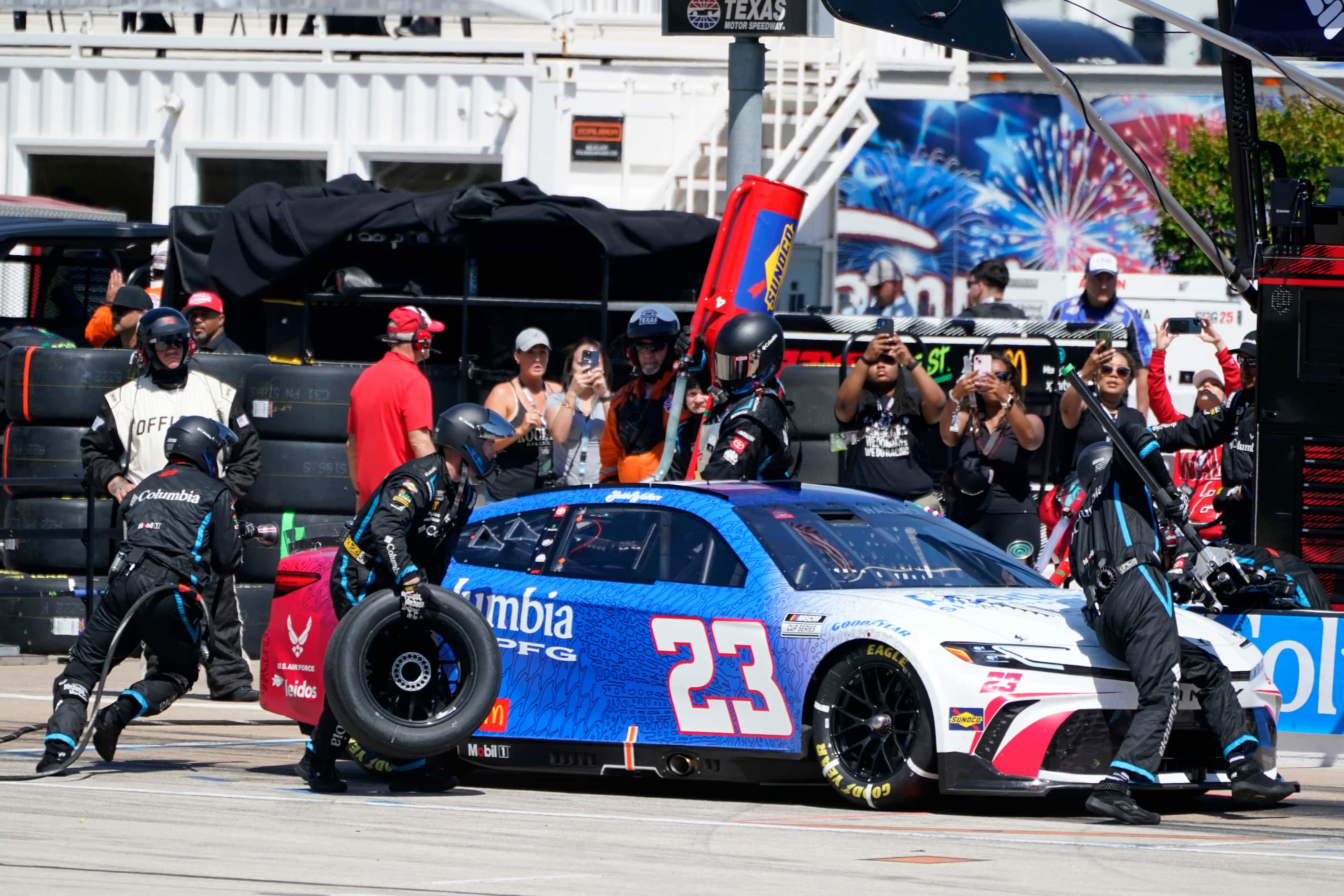 Bubba Wallace (23) pits during a NASCAR Cup Series auto race at Texas Motor Speedway in Fort...