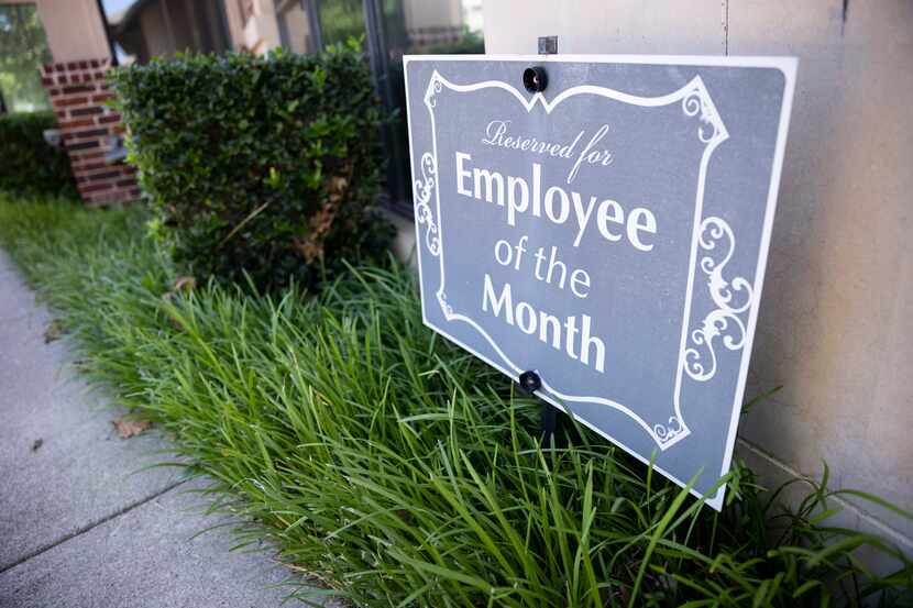 A reserved parking spot for the employee of the month is shown at the Black, Mann & Graham...