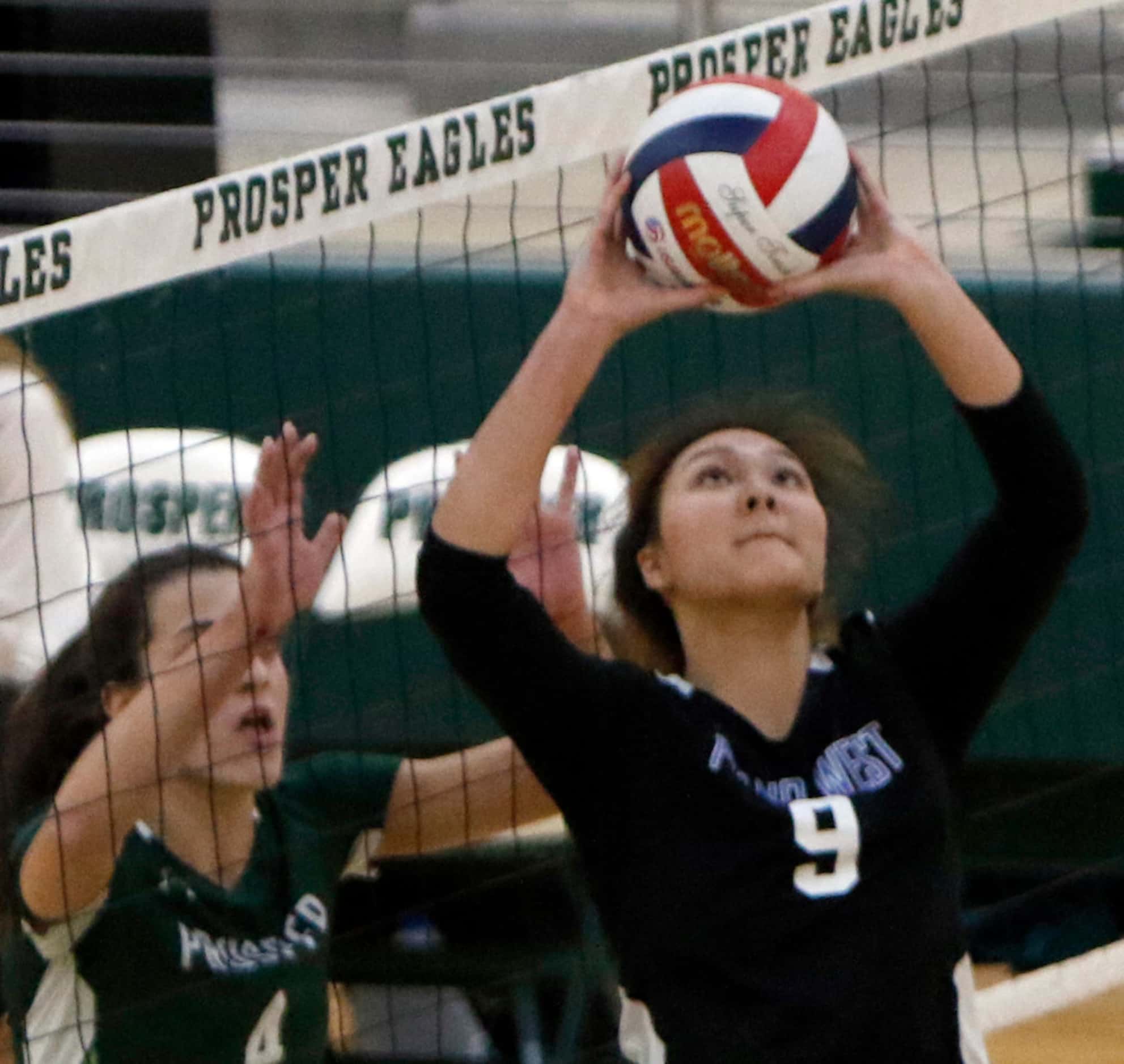 Sydney Le (9) from Plano West, sets a teammate during the second game of their match against...