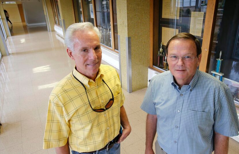 
Gary Rittenberry (left) and Jim Wilkinson pose for a photo at W.T. White High School in...