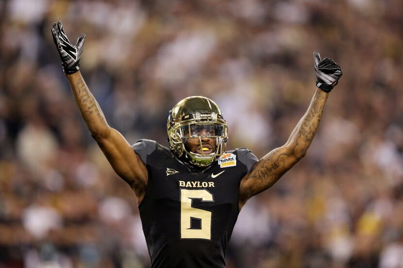 Ahmad Dixon of the Baylor Bears gestures to the crowd during their game against the UCF...