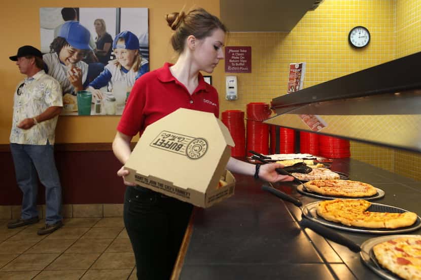 Shift leader Lisa Festger fills a to-go order at the CiCi's Pizza location on at 2220 Coit...