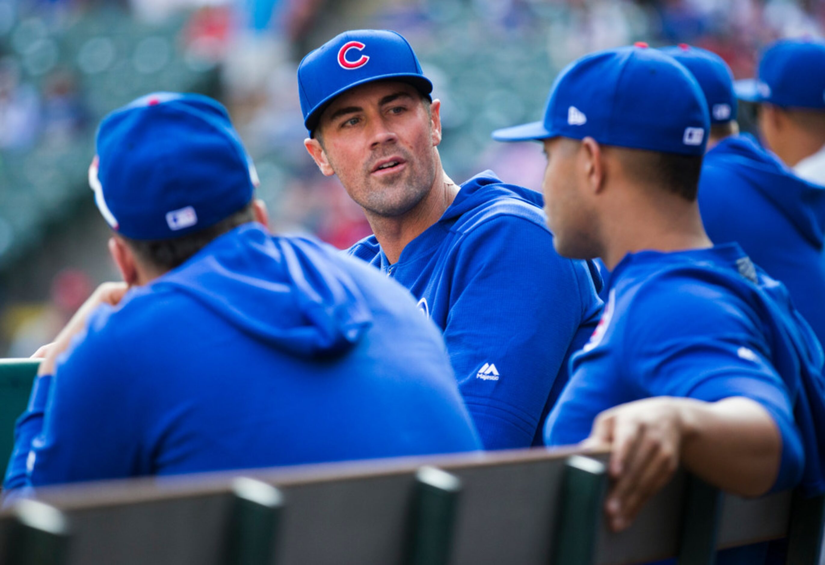 Chicago Cubs starting pitcher Cole Hamels (35) talks with teammates in the dugout during the...