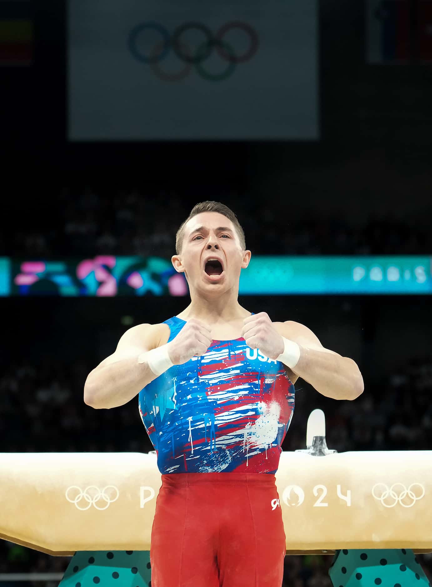 Paul Juda of the United States reacts after competing on the pommel horse during men’s...