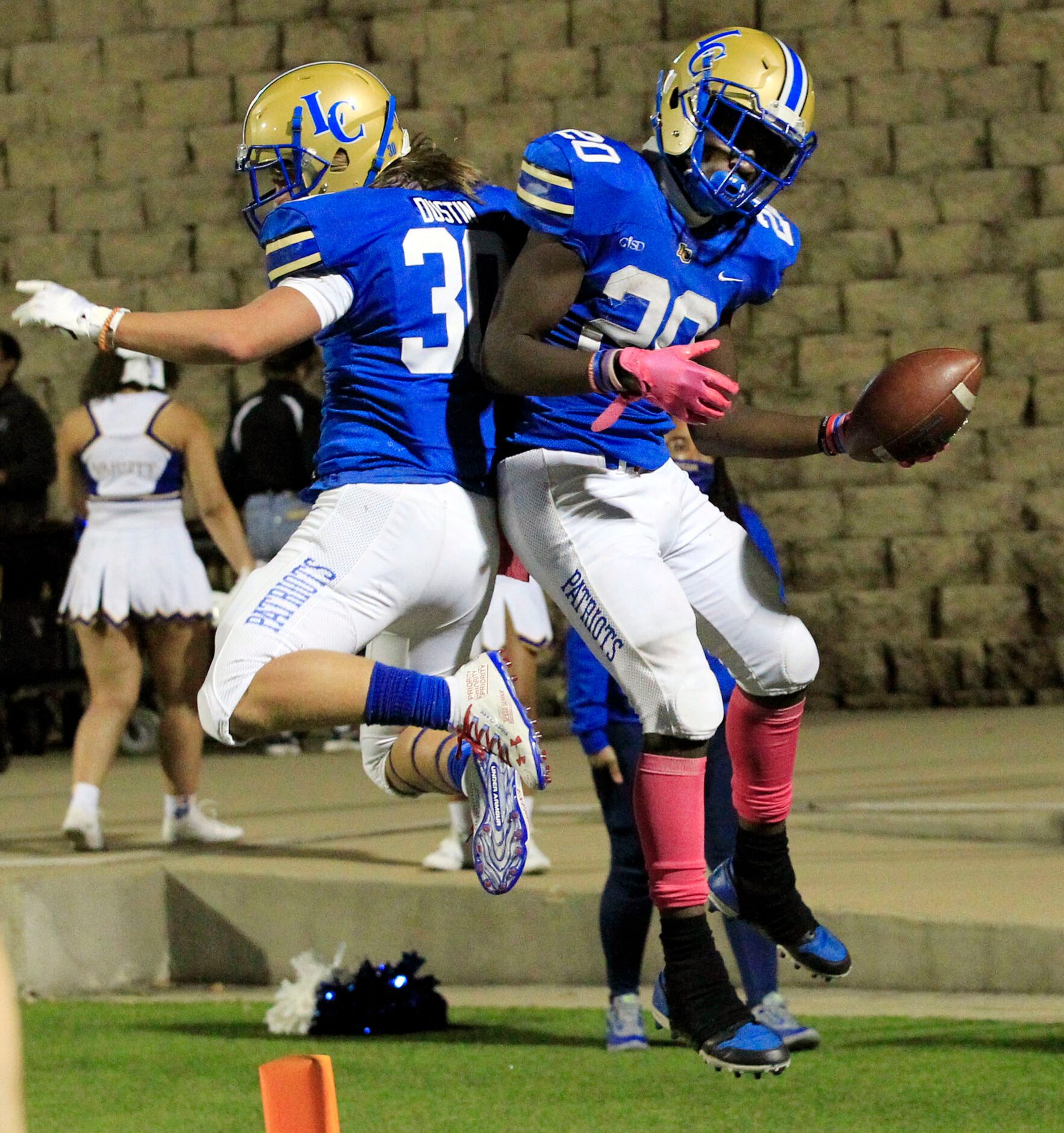 Lakeview RB Zechariah Dunston (20) and teammate Jack Dustin (30) celebrate, after Dunston’s...