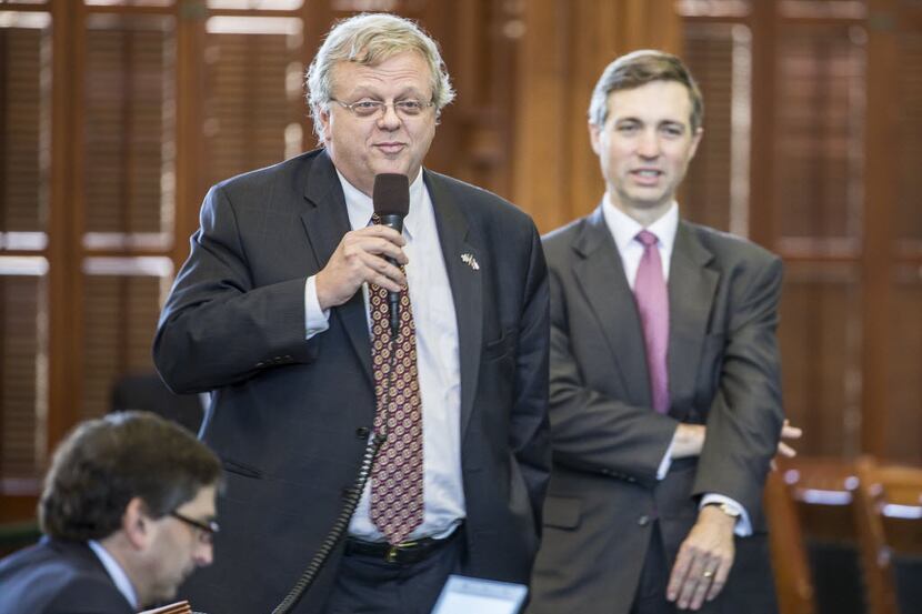 Sen. Paul Bettencourt debates tax cuts with Sen. Kirk Watson on the senate floor in Austin....