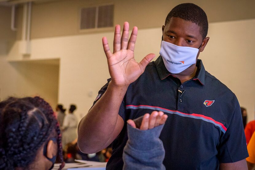 Arizona Cardinal football player, Kelvin Beachum, in partnership with World Vision and...