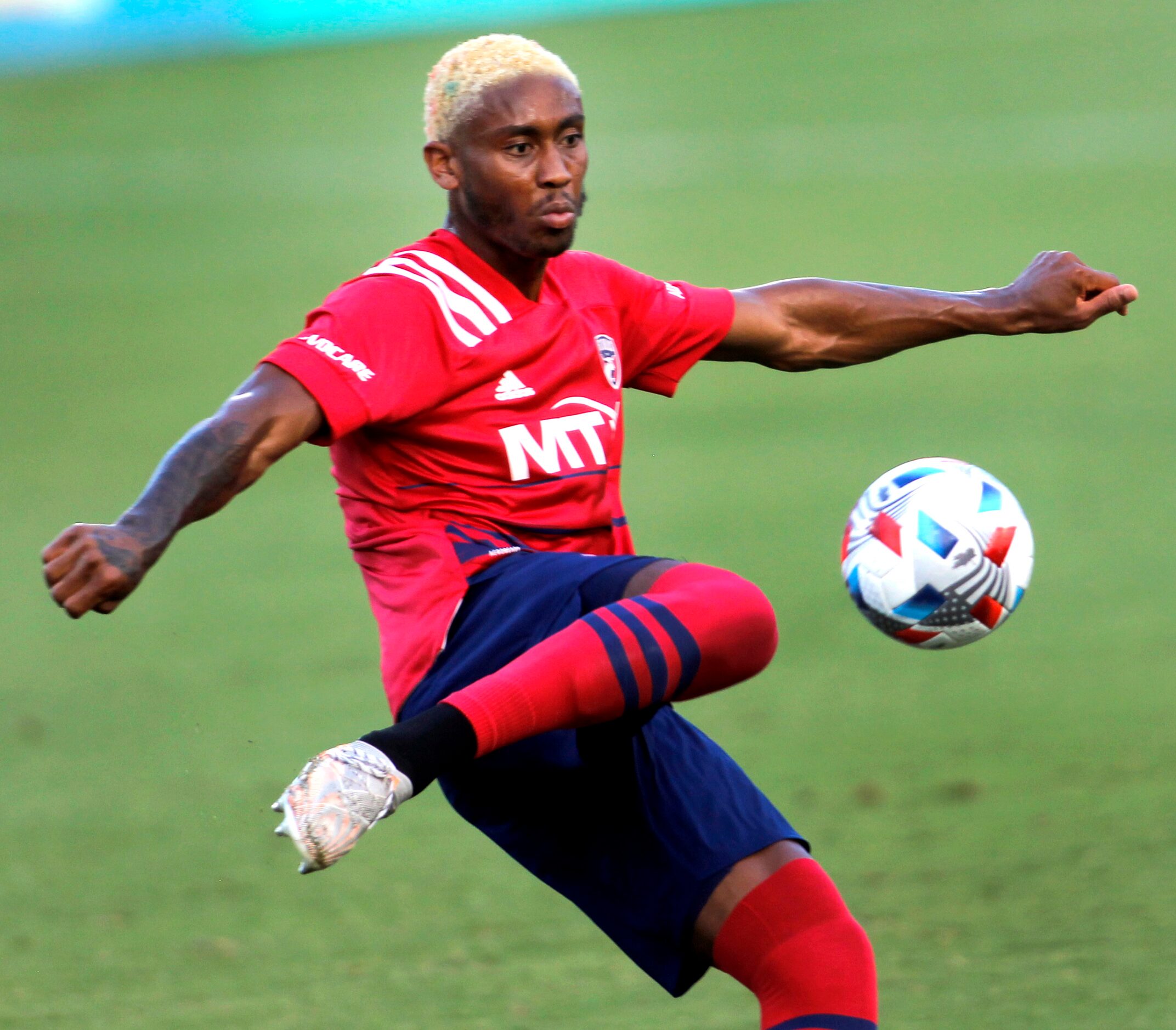 FC Dallas defender Nkosi Burgess (14) preps to clear the ball from outside the FC Dallas...