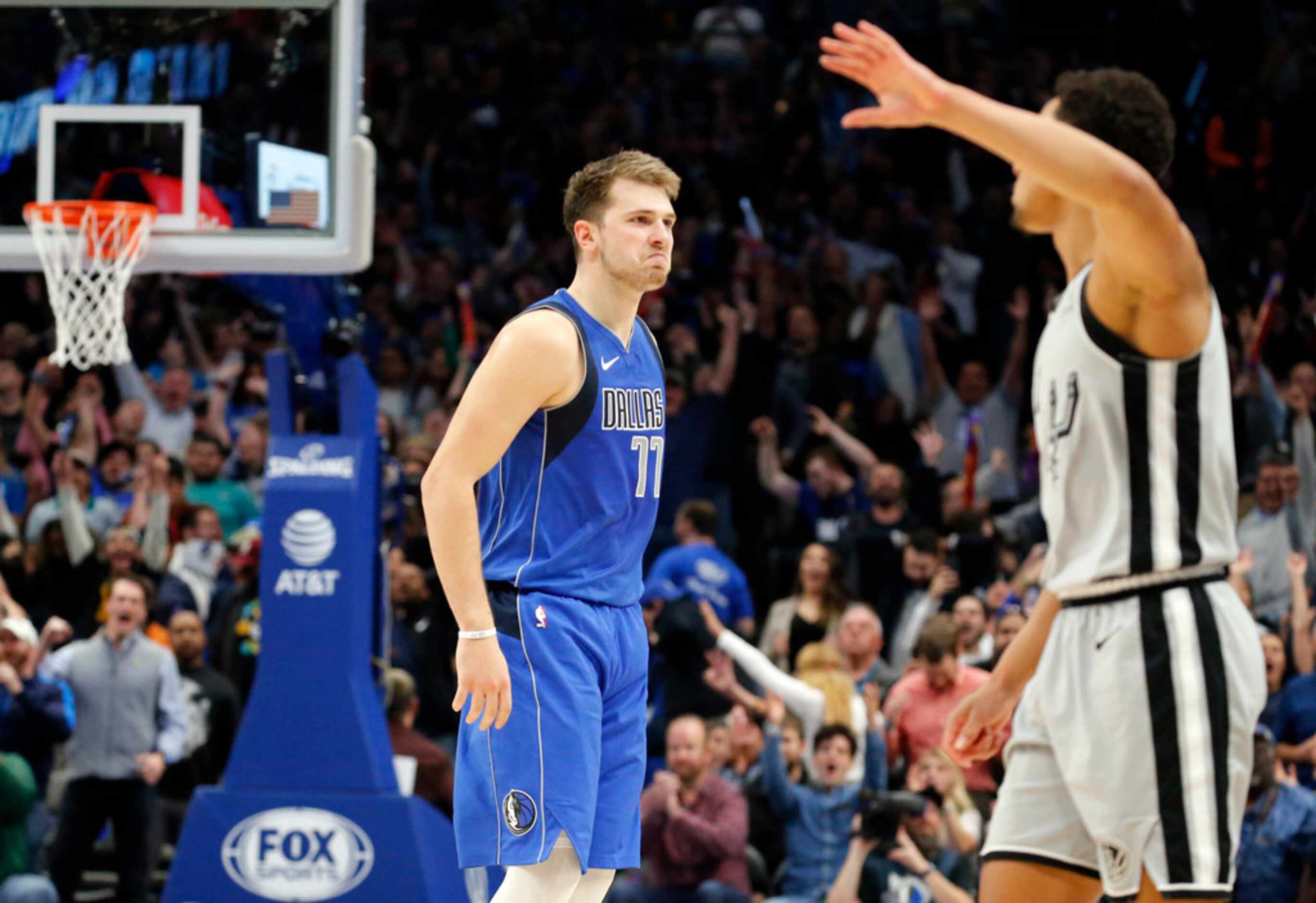 Dallas Mavericks forward Luka Doncic (77) reacts after hitting a three-pointer late in...
