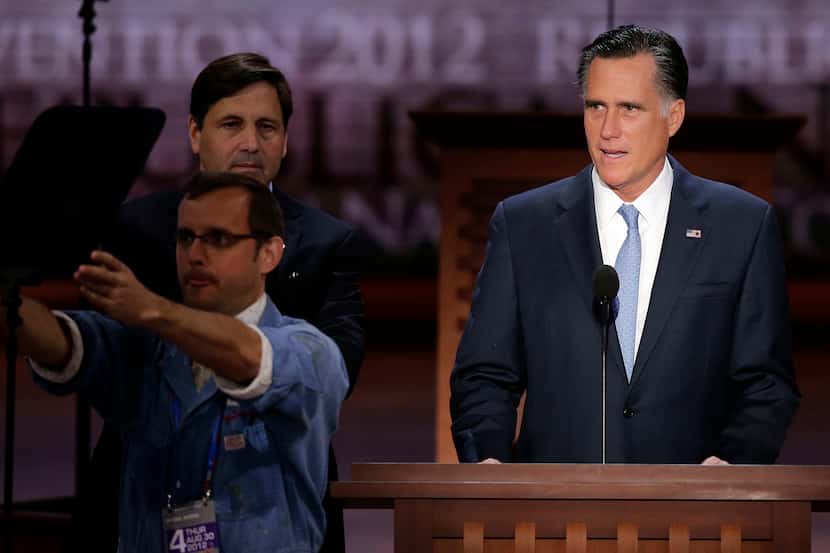 Republican presidential nominee Mitt Romney looks over the podium position during a sound...