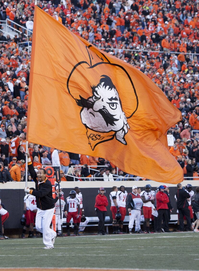 Nov 17, 2012; Stillwater OK, USA; Oklahoma State Cowboys cheer squad member Jovanny Aybar...