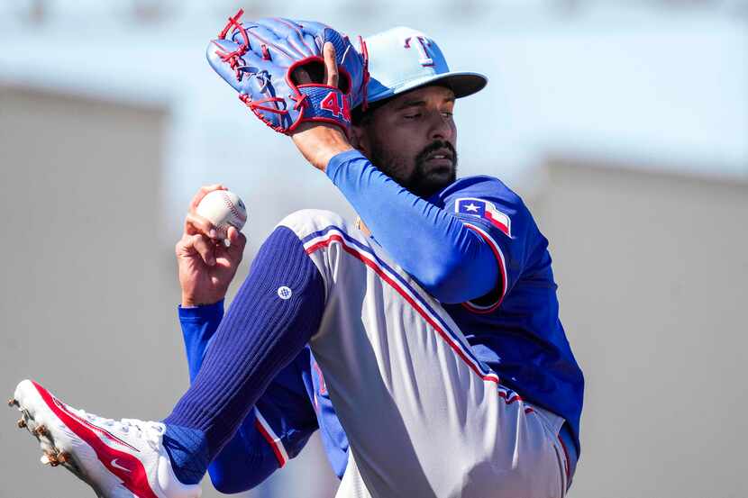 Texas Rangers pitcher Grant Anderson throws in the bullpen during the first Spring Training...