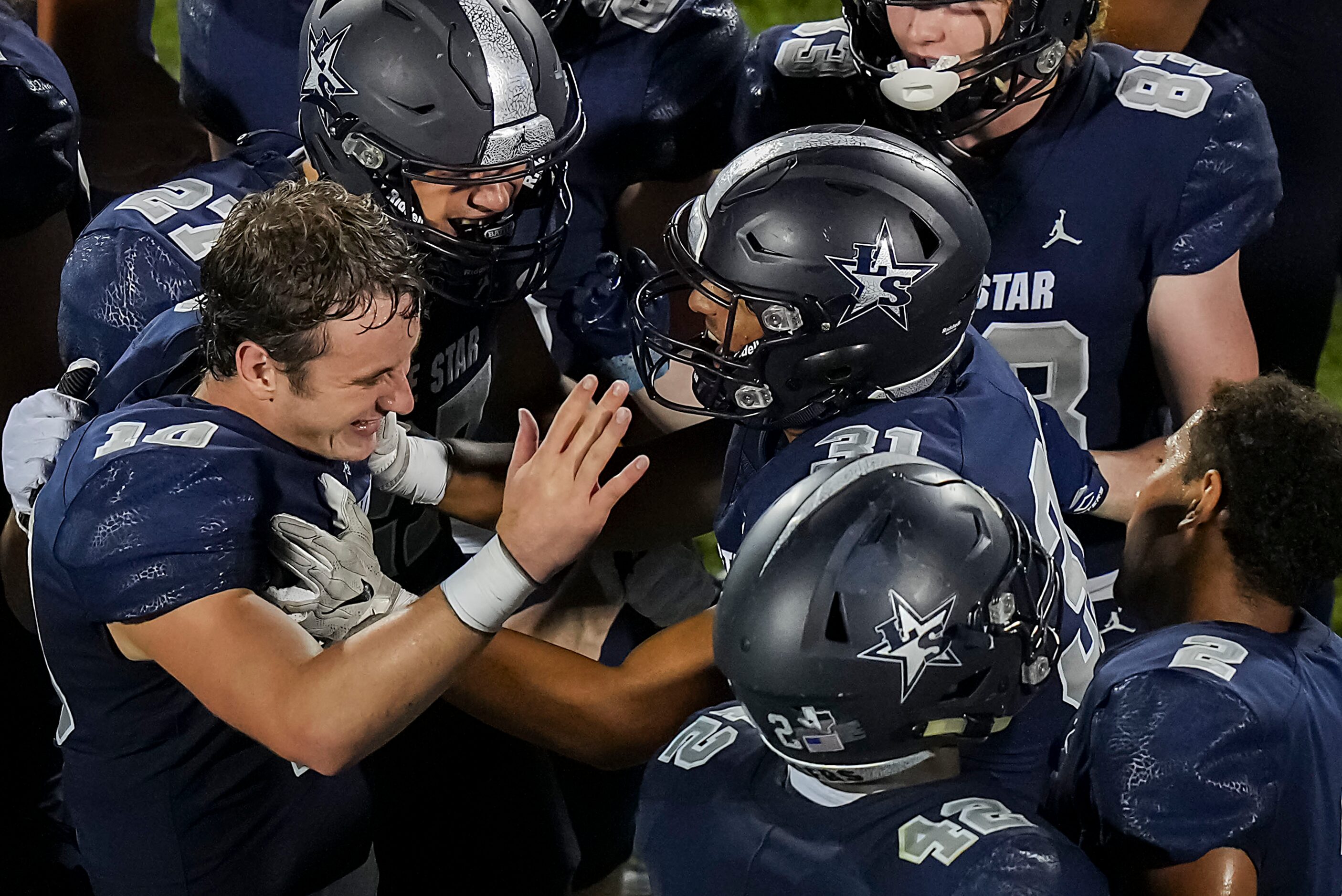 Frisco Lone Star quarterback Collin Blackstock (10) celebrates with teammates after throwing...