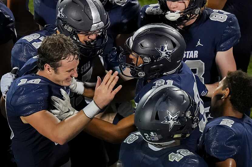 Frisco Lone Star quarterback Collin Blackstock (10) celebrates with teammates after throwing...