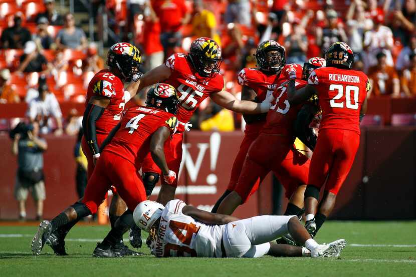 Maryland players celebrate in front of Texas wide receiver Lil'Jordan Humphrey (84) after...