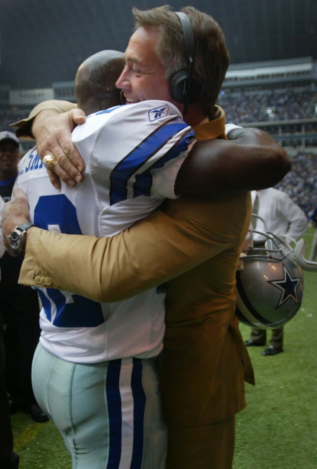 Dallas Cowboys running back Emmitt Smith celebrates with former teammate Daryl Johnston...