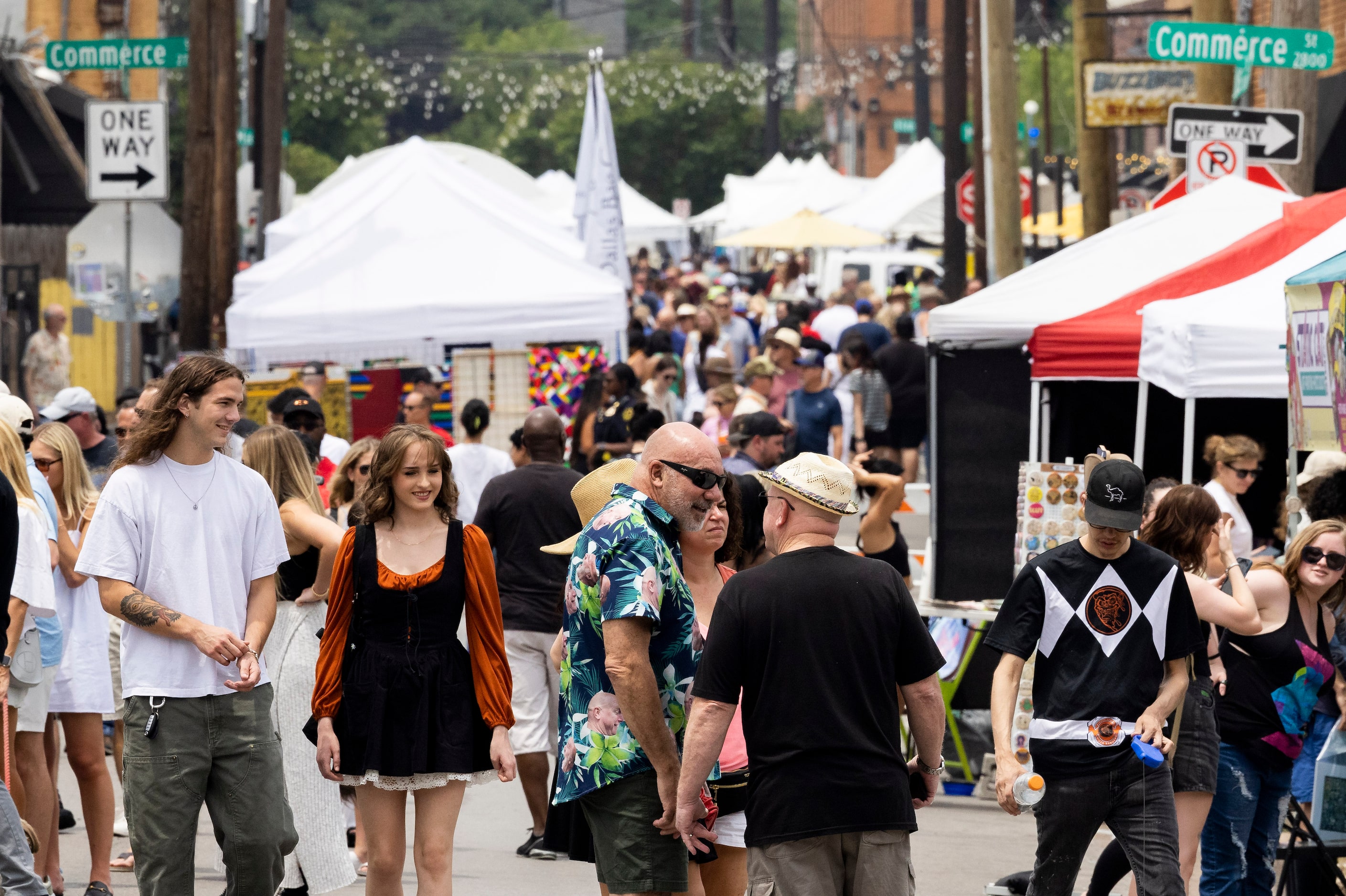 People look around during the Deep Ellum Community Art Fair in Dallas on Saturday, May 27,...