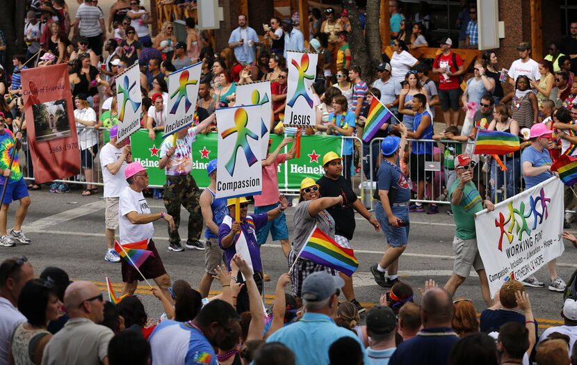 A group from Cathedral of Hope march in the Alan Ross Texas Freedom Parade on Cedar Springs...