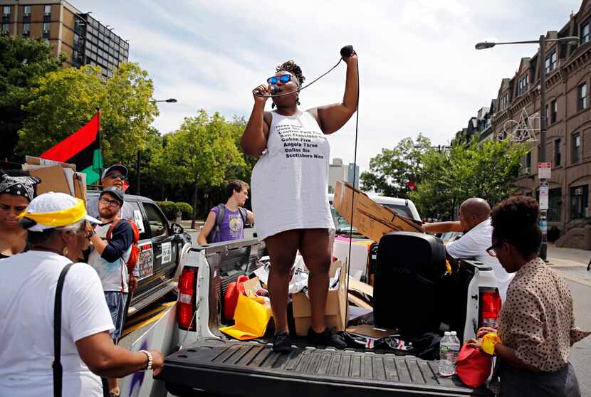 Protest organizers directed the crowd during a Black Lives Matter march Tuesday in...