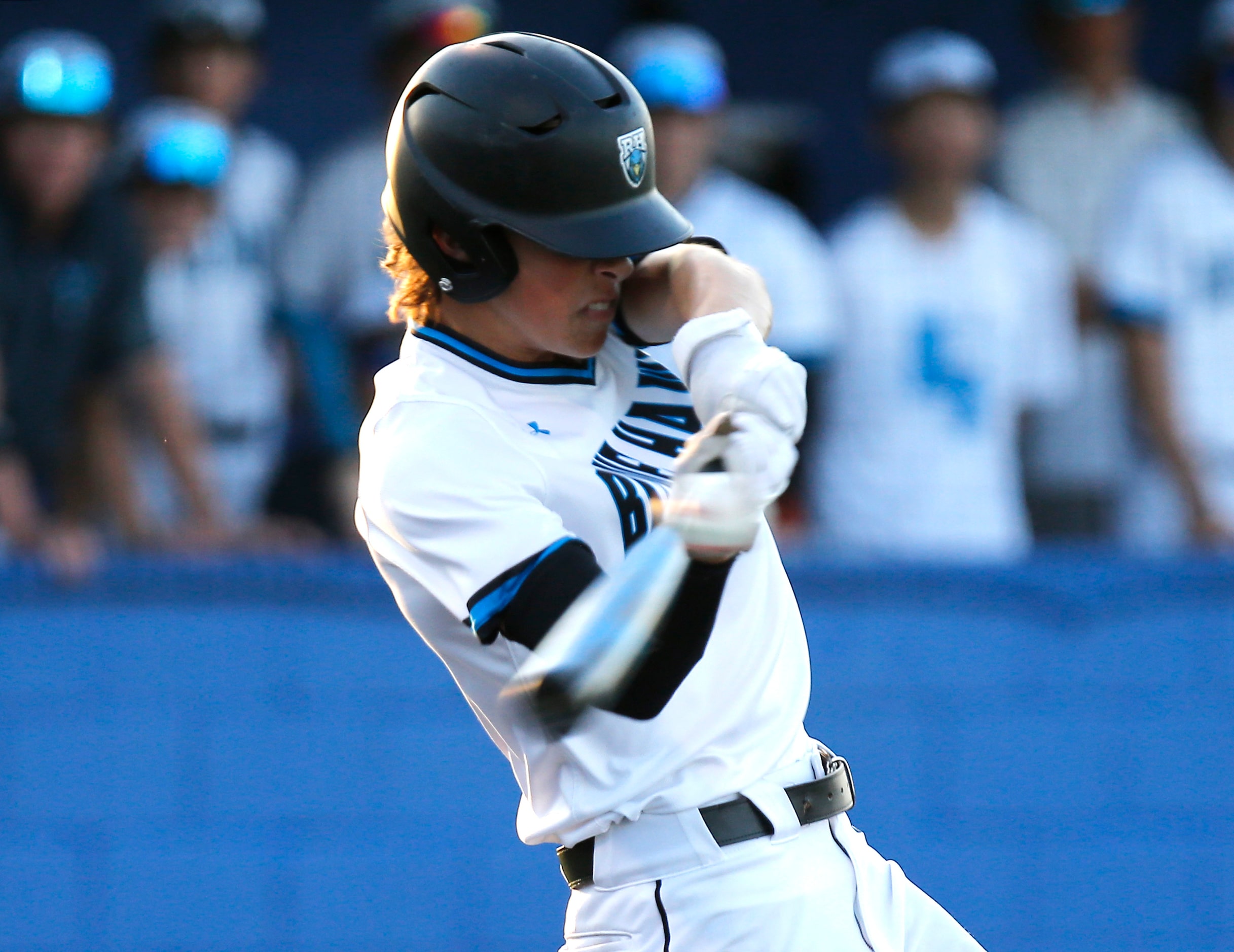 Rock Hill High School outfielder Tyler Powers (2) pops one up in the third inning as Lone...