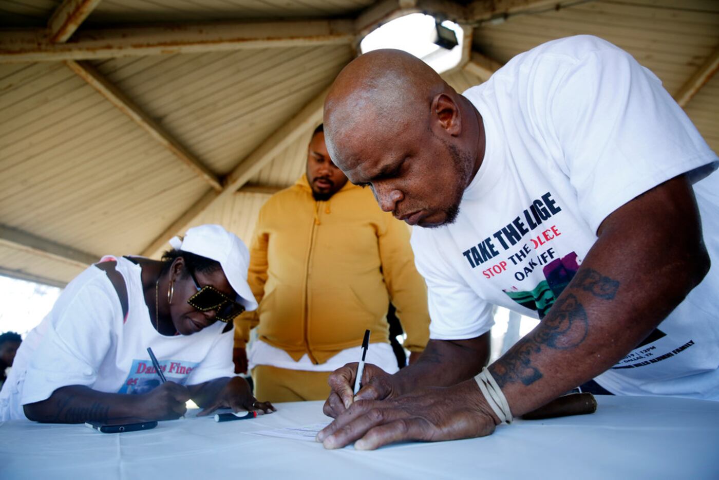 LaKeith Hall and others registered to vote during a Stop the Violence Oak Cliff picnic at...