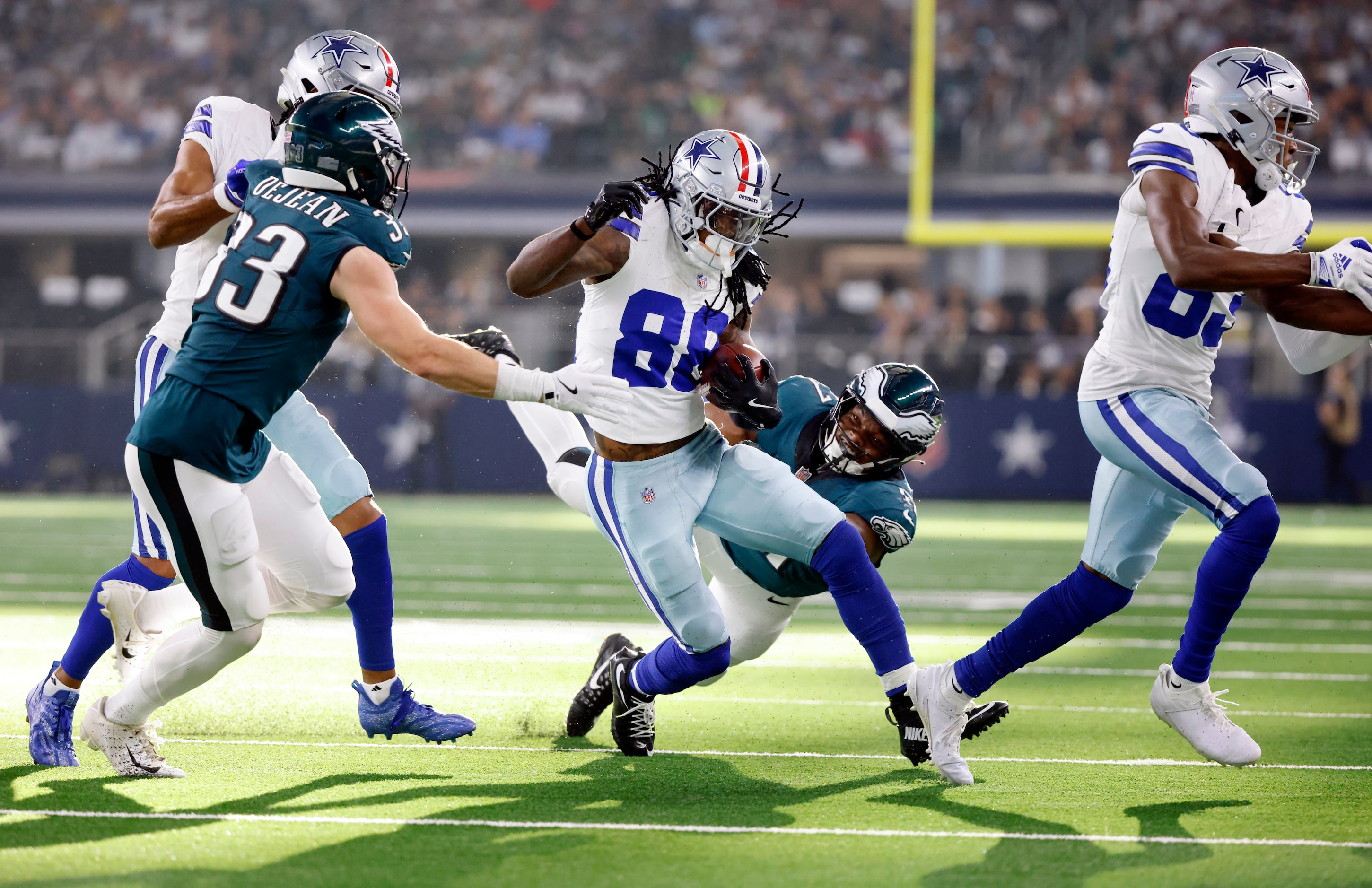 Dallas Cowboys wide receiver CeeDee Lamb (88) is brought down by Philadelphia Eagles...