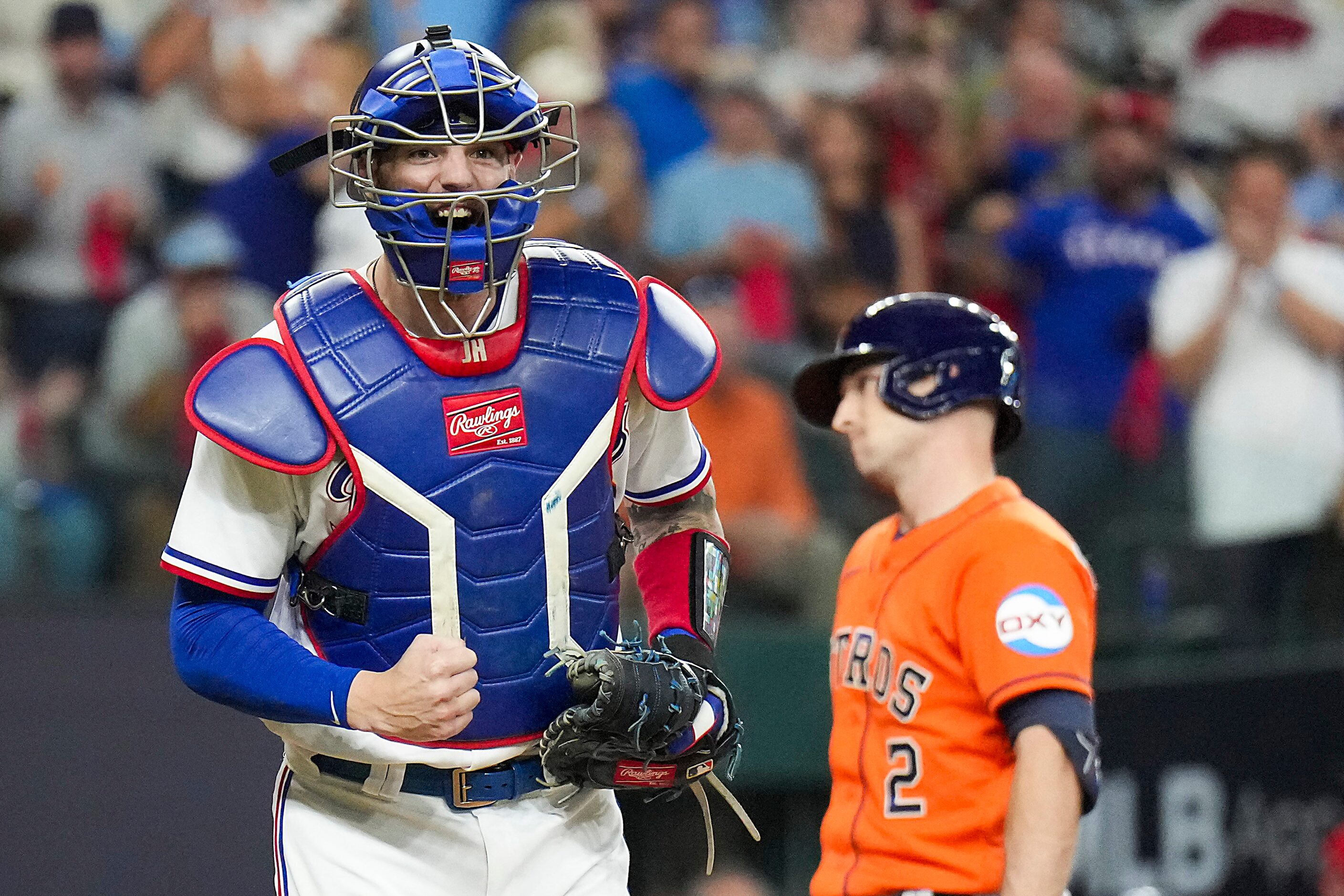 Texas Rangers catcher Jonah Heim reacts after Houston Astros third baseman Alex Bregman...